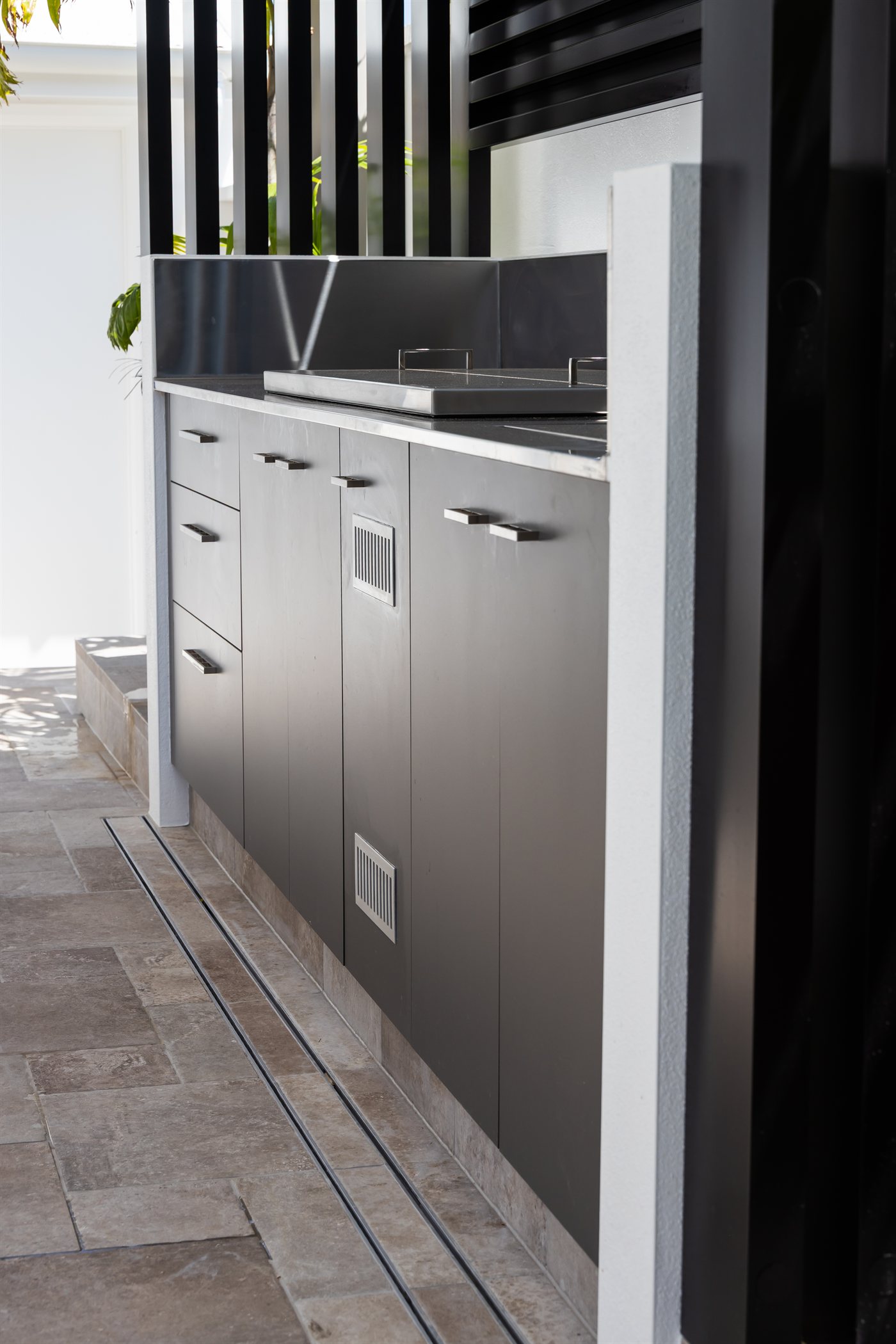 Weather-rated outdoor kitchen cabinetry and hotplate detail